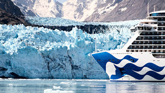 Cruise ship passing by a glacier.